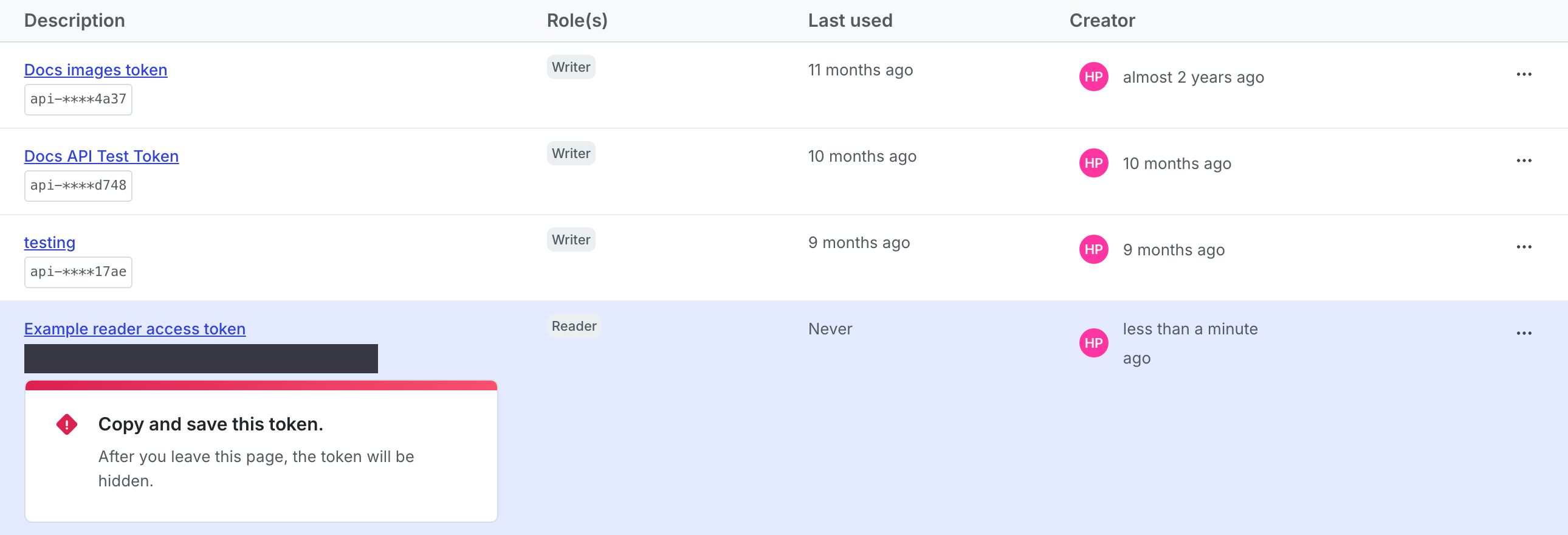 A new access token with a reminder to copy and store it displayed.