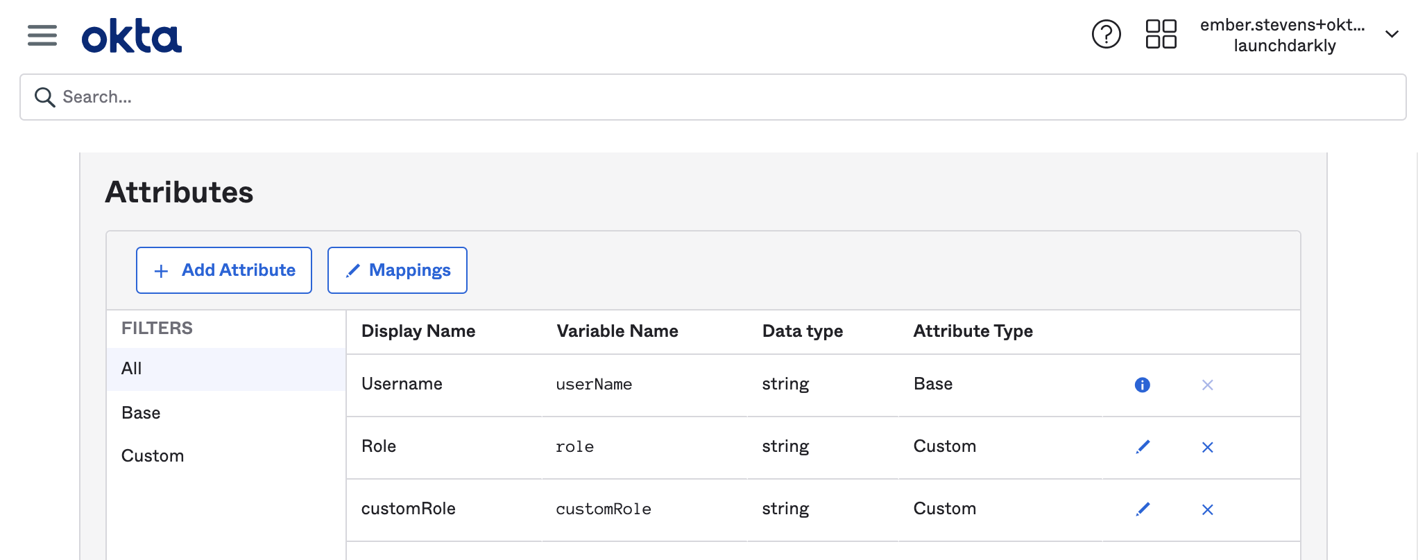 The Okta LaunchDarkly "Attributes" mapping screen with custom roles available.