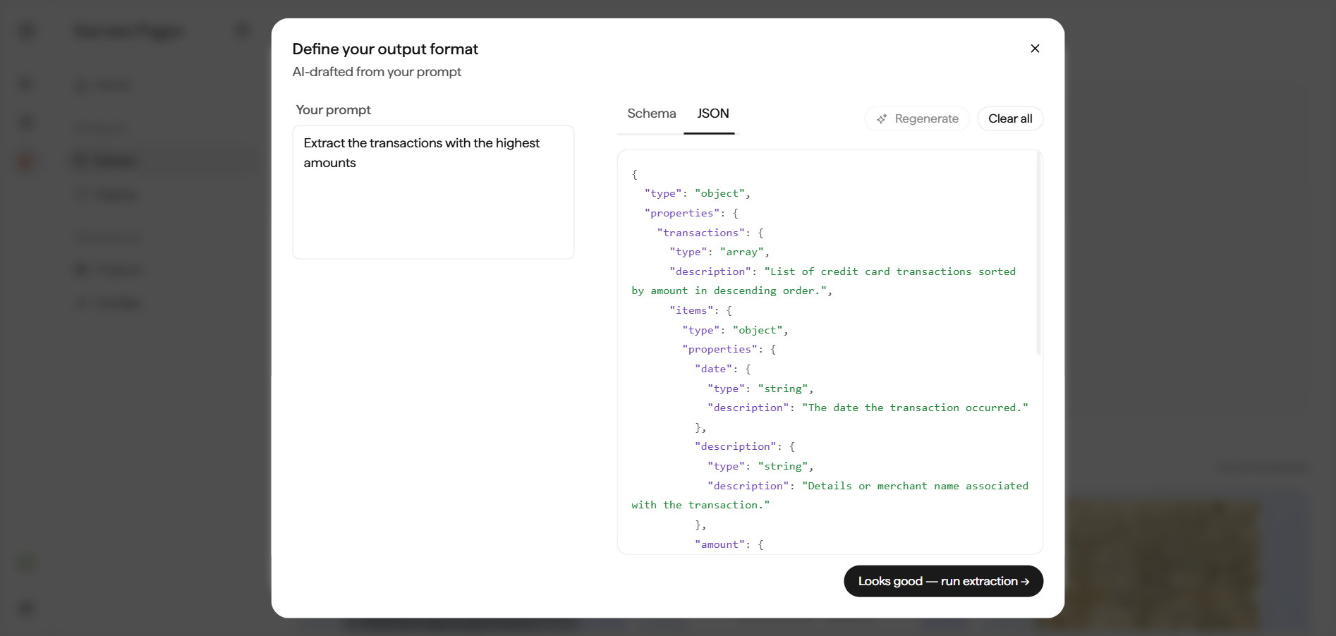 Define your output format dialog on the JSON tab, showing the AI-drafted schema as a raw JSON object with type, properties, and description fields.