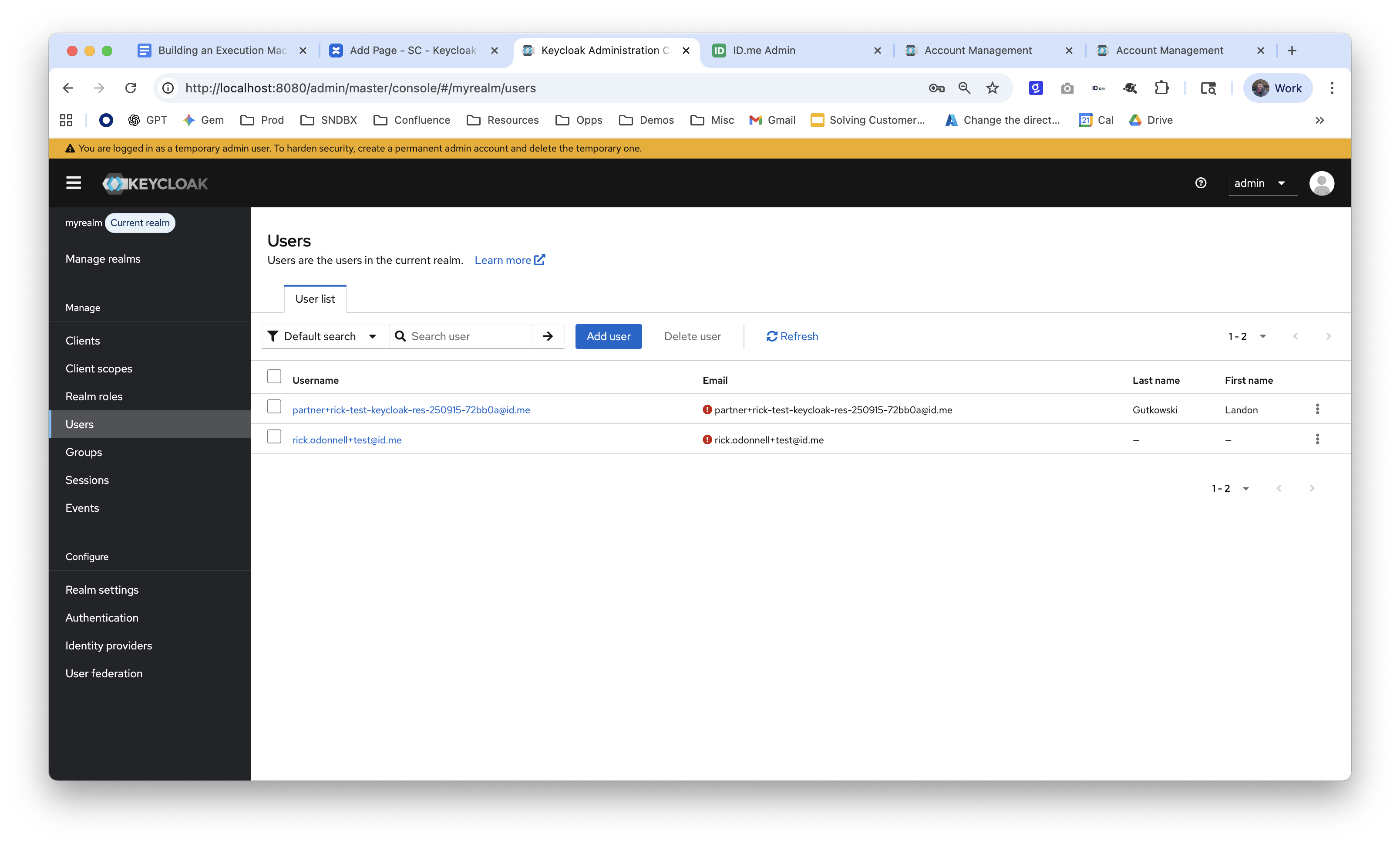 Screenshot of the Users list in the Keycloak Administration Console for "myrealm," showing two provisioned users with ID.me email addresses, confirming successful federated user creation after sign-in.