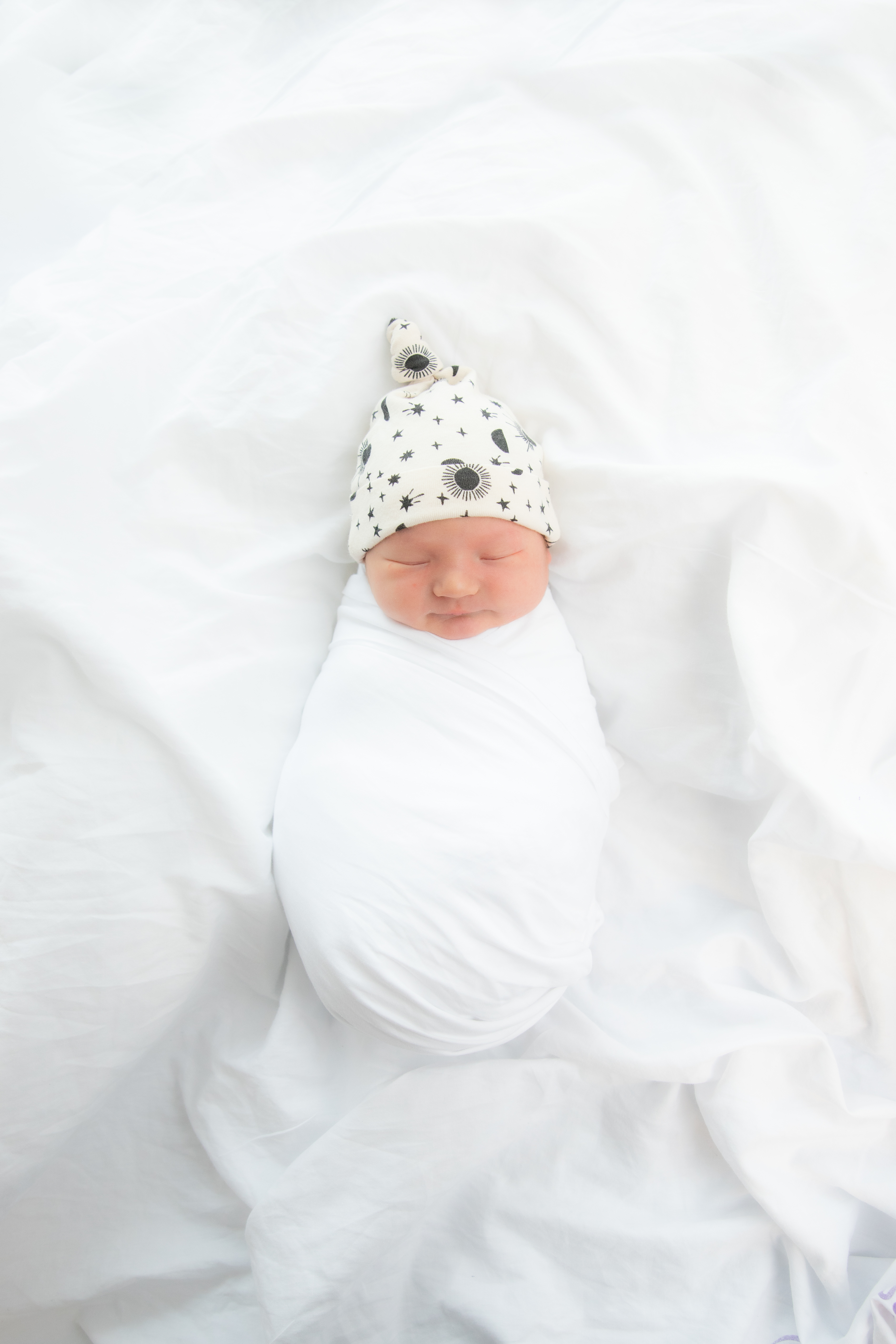 Baby wrapped in swaddle